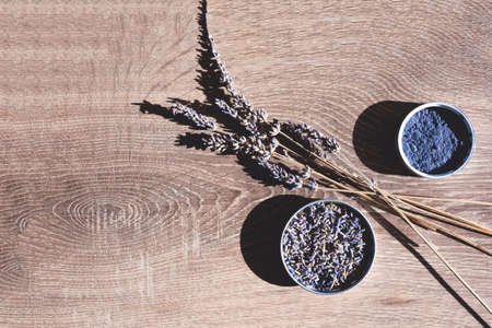 Cosmetic ingredients set made of organic lavender branches, lavender powder on woodenの写真素材