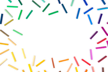 Rainbow bright colored pastel pencils on isolated whiteの写真素材