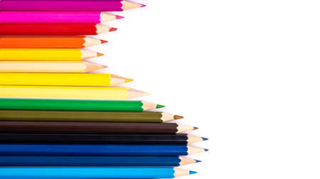 Rainbow bright colored pastel pencils on isolated white.の写真素材