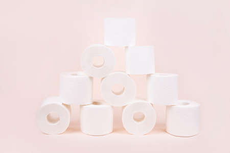 Toilet paper rolls stacked in the shape of a pyramid.の写真素材