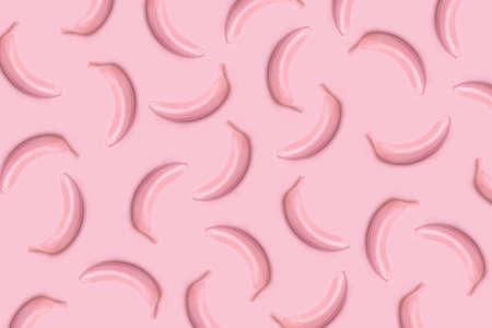 Modern pattern pop flat lay style made of  pink colored bananas on pink background. Festive or...