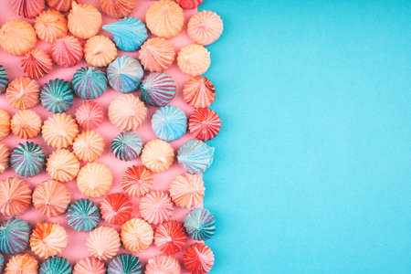 Soft pink and blue color of mini marshmallows dessert top view, flat lay style. Concept for holiday party card.の写真素材
