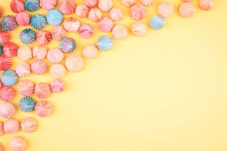 Soft pink, blue and orange color of mini marshmallows dessert top view, flat lay style. Concept for holiday party card.の写真素材