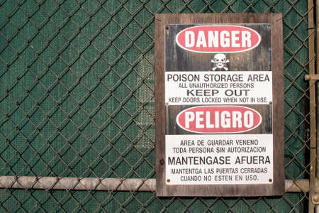 General poison storage area sign in English, with translation into Spanishの写真素材