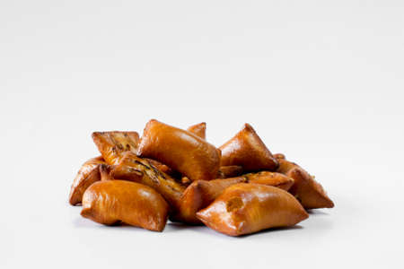 A portion of unsalted peanut butter pretzels on white backgroundの写真素材