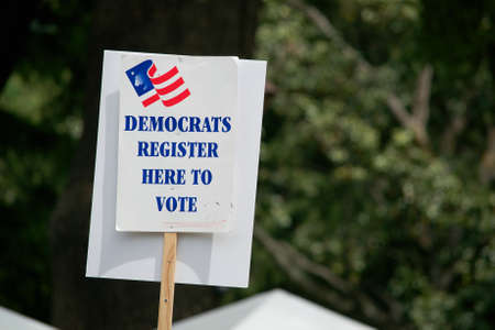Sacramento, California, USA. 22 Apr, 2017. Sign from the democratic party on the March for Science on Earth Day warning people of a voter registration boothのeditorial素材