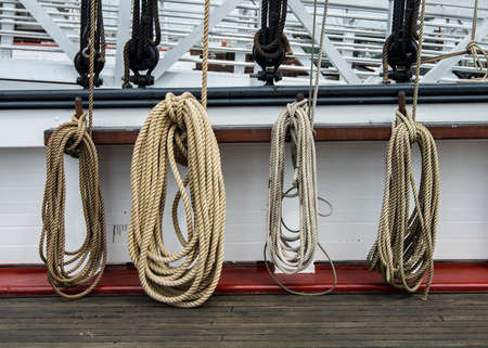 Four ropes hanging on an old ship