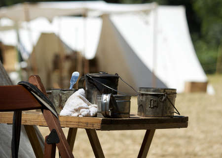 Kitchen of a typical encampment during the civil war time at a Civil War Re-enactment in Duncan Mills, California, USA, with canvas tents in the background の写真素材