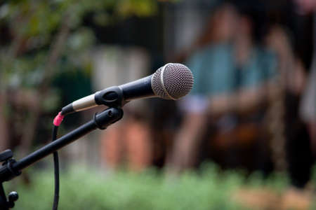 Selective focus on a microphone outdoors and lots of copyspaceの写真素材