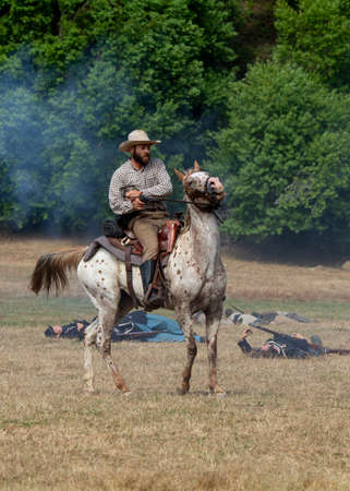 Duncan Mills, CA - July 14, 2018: Confederate soldier and horse at a Civil war reenactment. The...