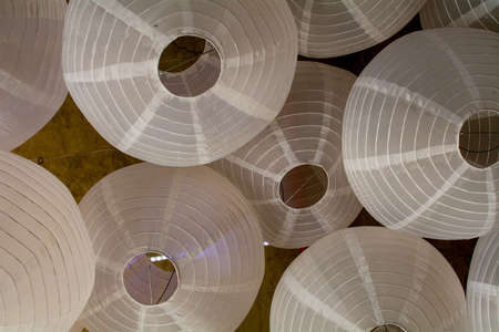 Festive background of Japanese lanterns white viewed from below- large happy copyspaceの写真素材