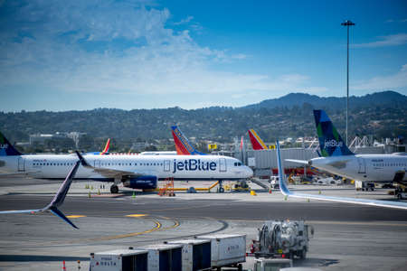 San Francisco, CA- September 4, 2019: Jet Blue airplane ready for boarding, viewed from the glass window of an airport in the Unitd States. JetBlue Airways Corporation is a major American airline low cost passenger carrier, and the sixth largest in the Unのeditorial素材