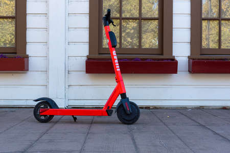 Sacramento,  August 18, 2019. Jump scooter parked on the sidewalk in Old Sacramento in front of a restaurantのeditorial素材