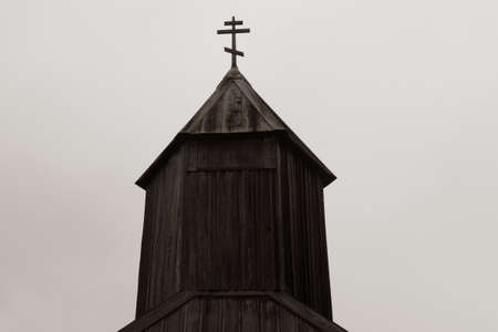 Detail of church at Fort Ross state park, a Russian Fort, on a foggy day, typical of the Sonoma Coast, California, USA in black and white with a sepia toneのeditorial素材