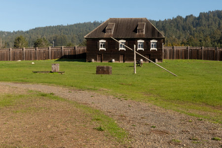 near Salt Point, 19 January 2021. Old Building and canon at Fort Ross state park, a Russian Fort, on a sunny day, California, USAのeditorial素材