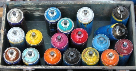Box with color spray cans used by an artist