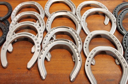 Metal horse shoes sold in a market stallの写真素材
