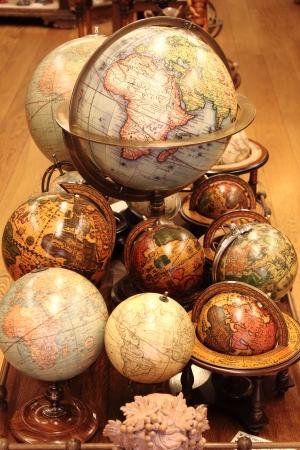Many different world globes for sale in an antiquarian shopの写真素材