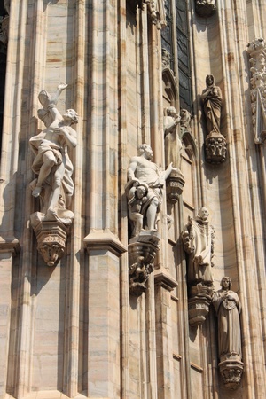 Gothic statues in the Milan cathedral, Italyの写真素材