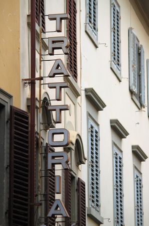 Trattoria vintage sign on an old building in Florence, Italy .の写真素材