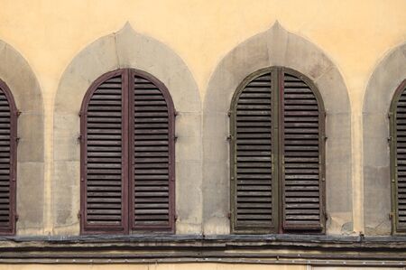 Arched windows with closed shuttersの写真素材