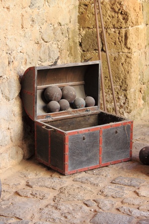 Old chest used to store cannonballsの写真素材