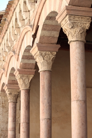 Arches in a medieval colonnade of a cloisterの写真素材