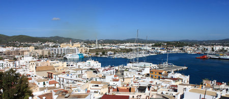 Ibiza Town, Spain - October 17, 2012: Panoramic view of Ibiza town with ferries moored in the harbourのeditorial素材