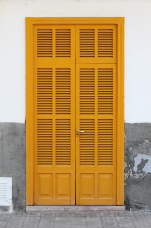 Italian style house entrance with shuttersの写真素材