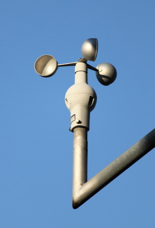 Anemometer on blue sky backgroundの写真素材
