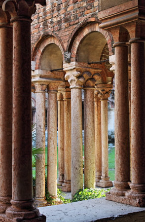 Columns and arches in the medieval cloister of Saint Zeno. Verona, Italy - HDRのeditorial素材