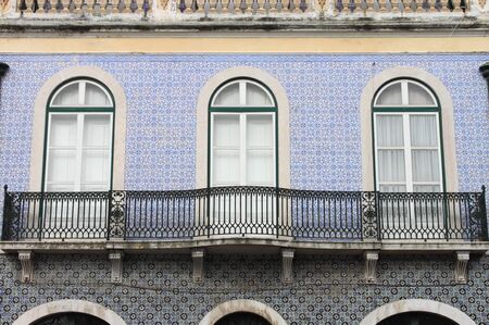 Typical portuguese windows with azulejo tilesの写真素材