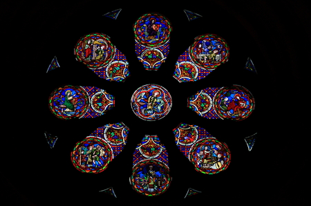 Stained glass rose window with catholic scenesの写真素材
