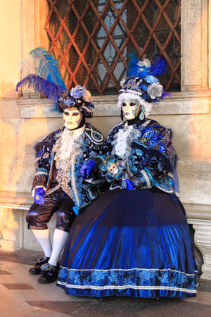 VENICE - FEBRUARY 10: Two people in Venetian costume attends the Carnival of Venice on February 10, 2018 in Venice, Italyのeditorial素材