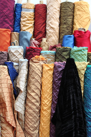 Colorful fabric rolls for sale in a haberdasheryの写真素材