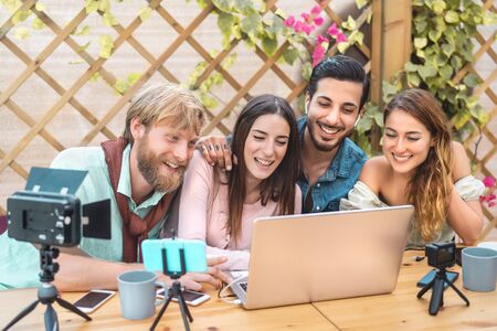 Young vlogger friends filming video for online web channel - Happy millennial people having fun...