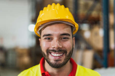 Portrait of happy young man working in delivery warehouse - Logistic and industry conceptの写真素材