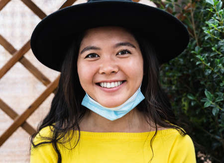 Portrait of smiling Asian woman during  virus outbreak