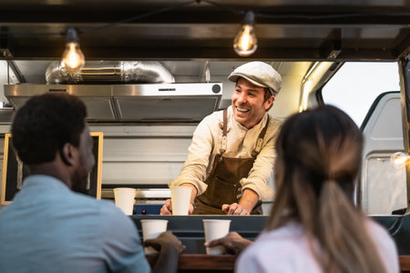 Happy multiracial people buying meal from street food truck market - Modern business and take away conceptの写真素材