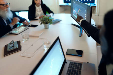 Business traders people in meeting room working on crypto currency markets with blockchain technology - Decentralized finance and stock exchange conceptの写真素材