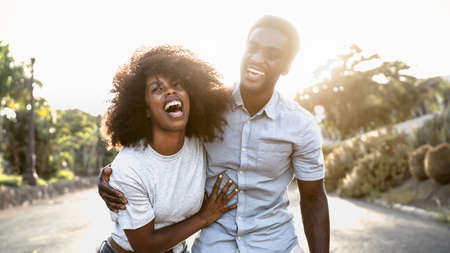 Happy African couple having fun dating outdoorの写真素材