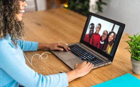 Happy African family doing video call using laptop at home - Technology and communication conceptの写真素材