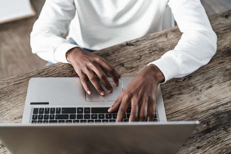 Top view of African man using laptop at home - Technology conceptの写真素材