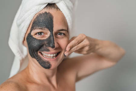 Happy mature woman having skin care spa day - People wellness lifestyle conceptの写真素材