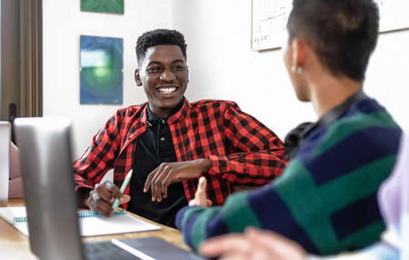 Young multiracial people studying together - School education conceptの写真素材