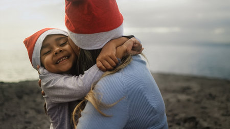 Happy Latin family enjoying Christmas holidays - Parenthood and holidays concept