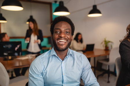 Happy African man in coworking creative spaceの写真素材