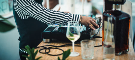 Dj playing music with mixer player at cocktail bar - Party nightlife conceptの写真素材