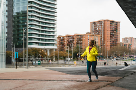 African senior woman running in the city - Elderly Sporty people lifestyle conceptの写真素材