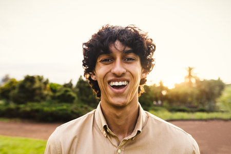 Happy young teenager smiling in front of cameraの写真素材